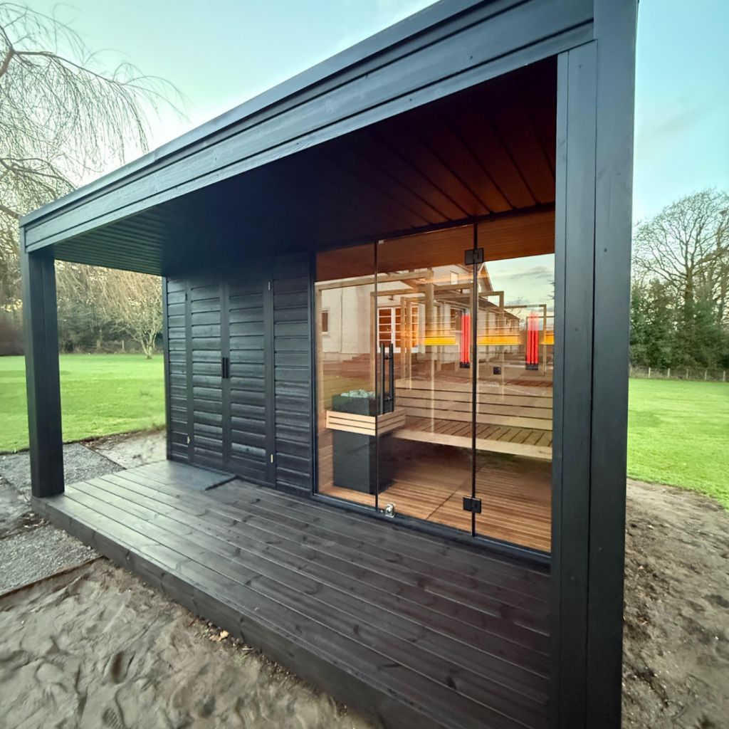 Custom Auroom outdoor dual sauna in modern garden setting
