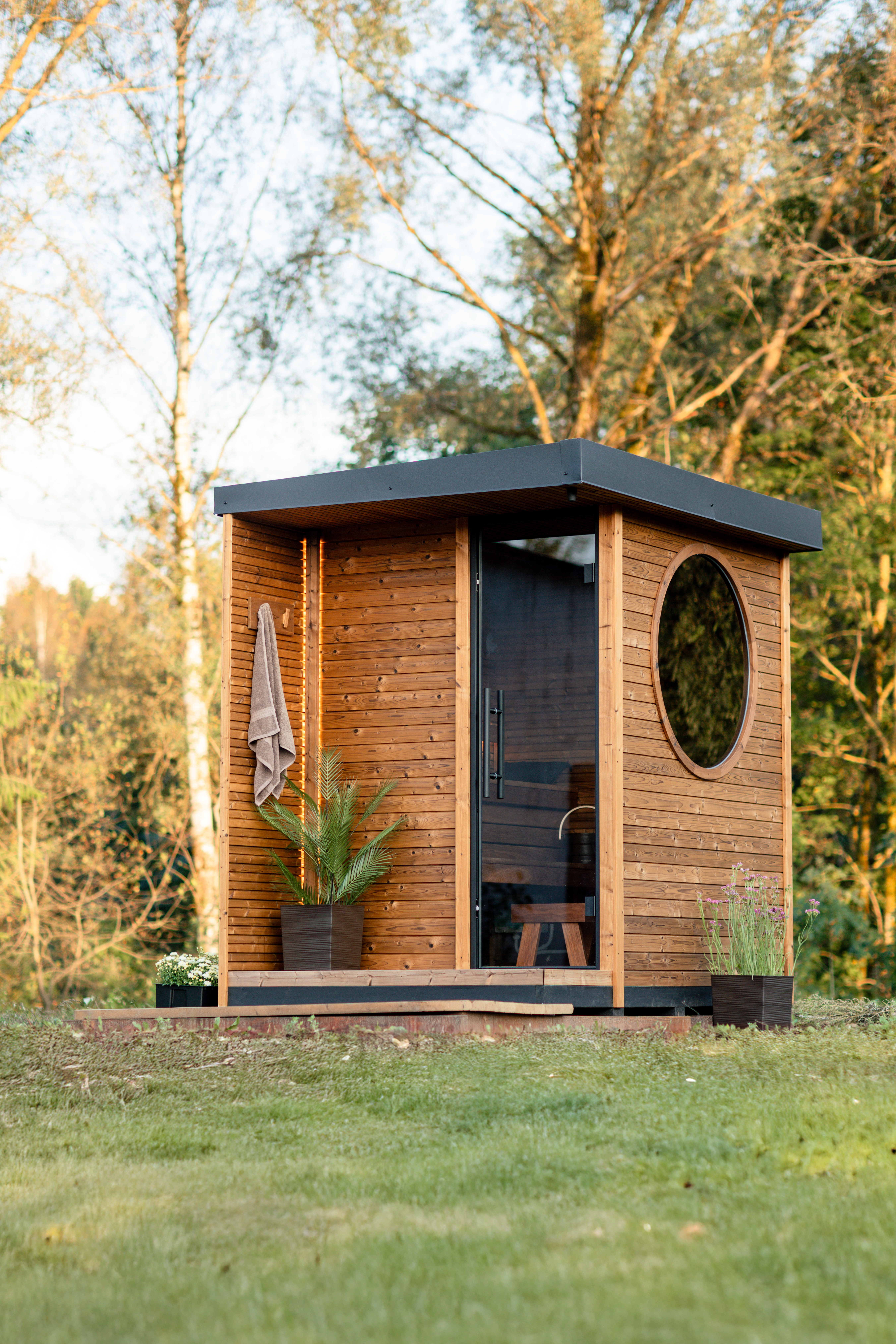 Kaia outdoor sauna with round window