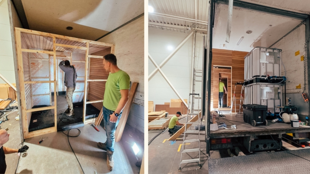 Auroom team members assembling the sauna and washing areas inside the truck. Wooden framing and insulation are being installed as part of the conversion process.