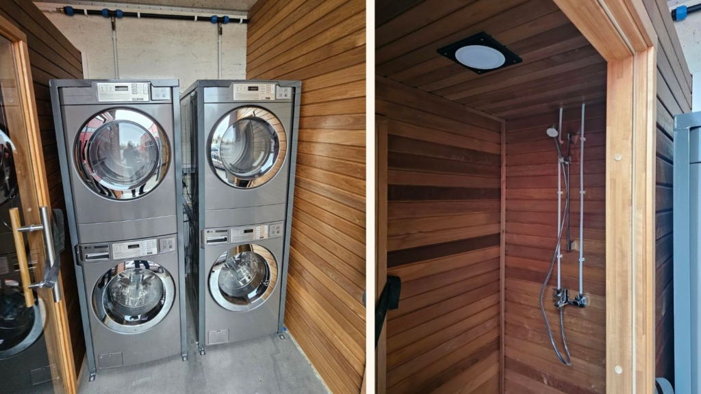 Inside the completed mobile sauna truck - modern washing machines and wooden shower cabins installed to provide comfort and hygiene in the field.